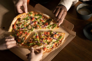 What Makes Freshly Prepared Pizza by the Slice a Local Favorite